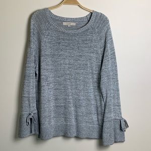 Shimmery silver sweater with tie bell sleeves